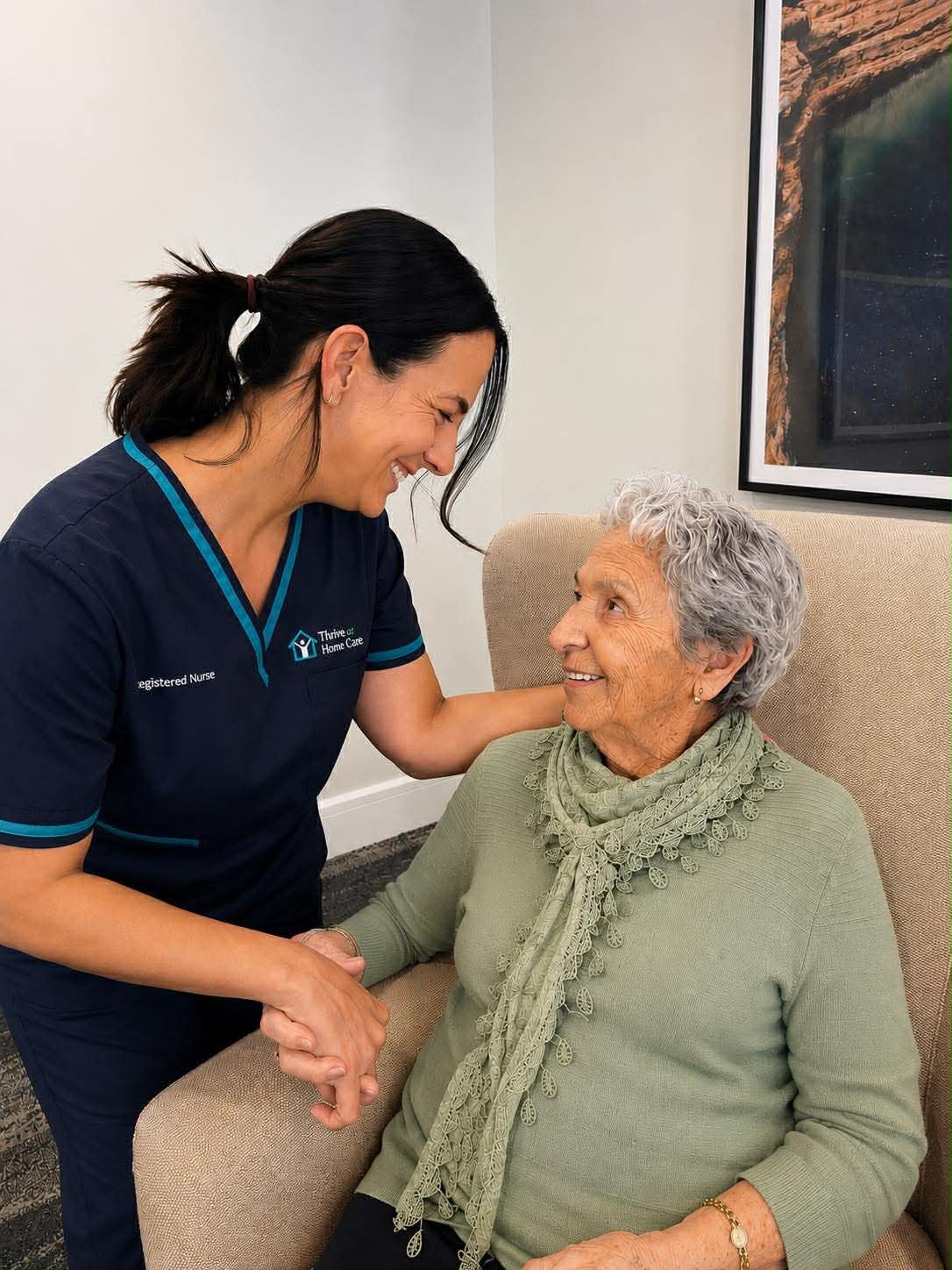 Caregiver gently supporting an elderly woman at home